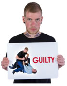 person holding guilty sign