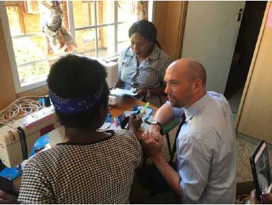 Minister for Europe, Migration and International Development, Ben Macpherson, visiting the Fistula Care Centre at Bwaila Hospital in Lilongwe - meeting some of the women involved in manufacturing reusable sanitary towels.