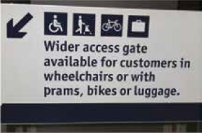 Wider access gate sign at Waverley Station