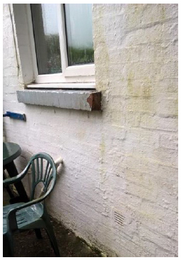 Photo 3: Extension wall construction showing thickness of wall. Condensation is visible on inside of kitchen window