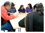 people sitting around a meeting table