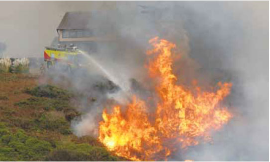  Photo B3.5 Showing a significant increase in fire intensity due to the fire now burning upslope