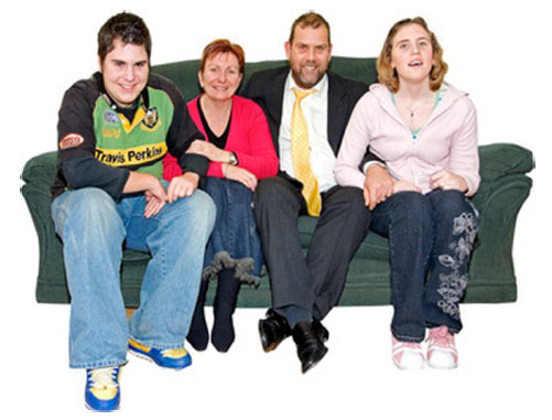A family sitting on a couch A family sitting on a couch