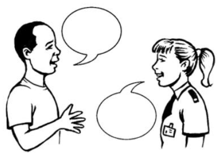 A man talking to a Police officer. Both are having their say and listening to each other
