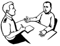 A man and a Police officer sitting at a table. The man is talking and the Police officer is listening and taking notes