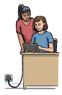 A woman sits at a desk, and is using electronic communication equipment to communicate with a woman who is standing next to her. The communication equipment is plugged into a power socket in the wall .