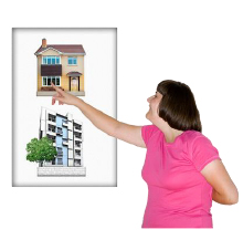 Picture of a house and also a block of flats, with a person who is pointing to the house Picture of a house and also a block of flats, with a person who is pointing to the house
