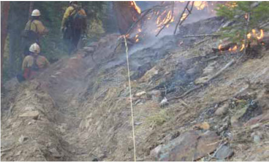Photo B8.3 A Catch Trench on a slope and constructed to prevent burning material from rolling down slope