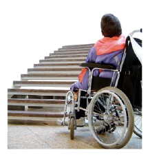 person in wheelchair at bottom of stairs