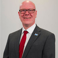 A photograph of Kevin Stewart, Minister for Mental Wellbeing and Social Care