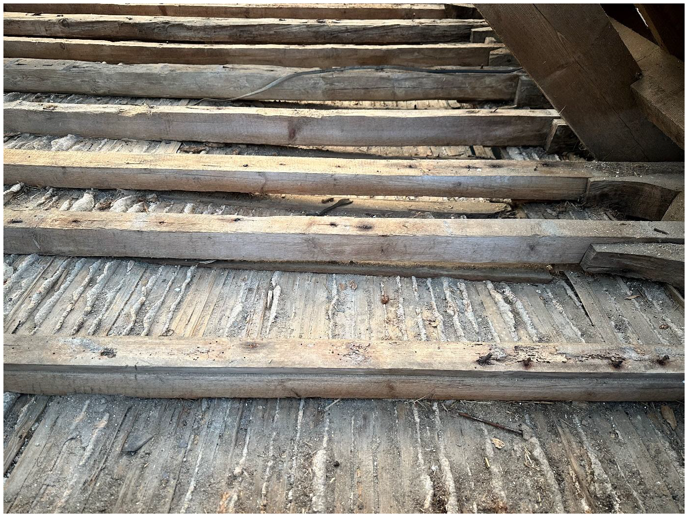 Poor fixing of traditional lath and plaster to joists.