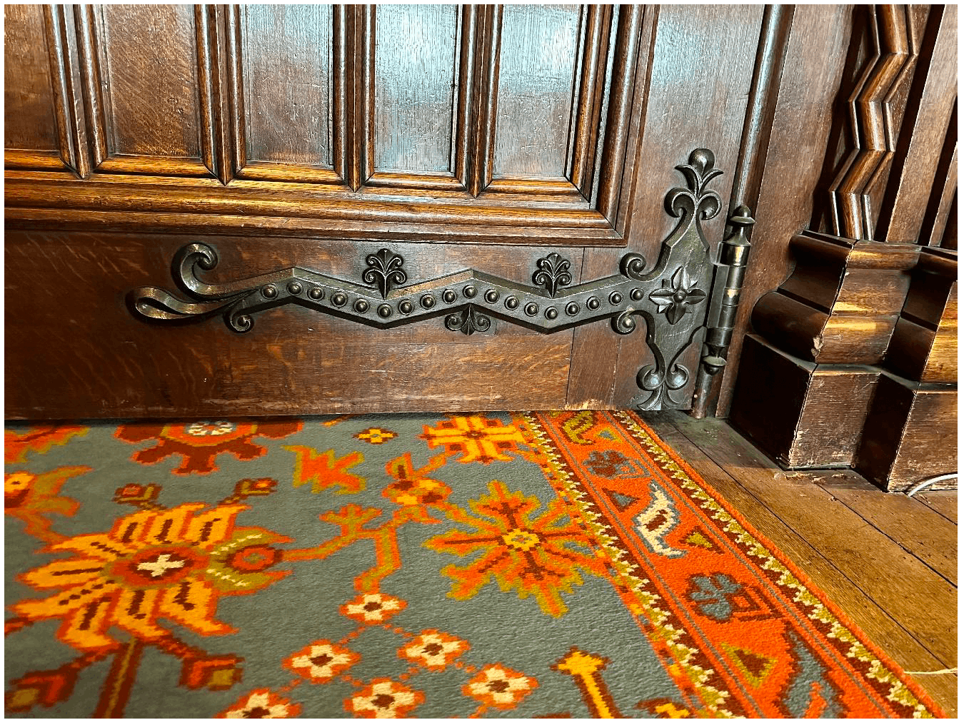 A historic door with an ornate hinge