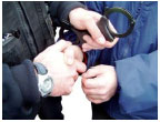 a person putting handcuffs on another person