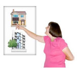 Woman pointing to a poster with two buildings on it