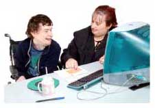 two people talking beside computer