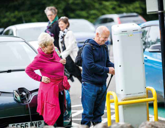 An electric vehicle being charged at one of ChargePlace Scotland's network of charge points