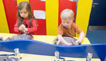 Children enjoying hand washing