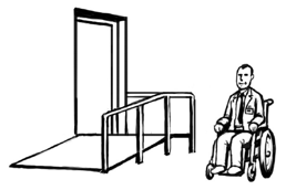 A man in a wheelchair looking happy. Next to him there is a ramp leading up to a door