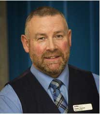 Photo of Derek Barron, the Chair of the Review