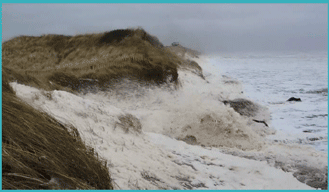 Image 2: Coastline with rough sea crashing against rocks and dunes.
