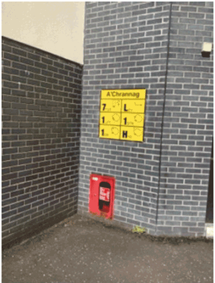 This image shows a Dry Riser Inlet and a High Rise Premises Information Plate