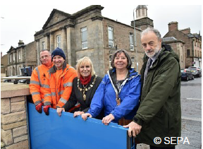 A photo of one of Inverness’ flood gates, with some of the people involved in the joint training exercise A photo of one of Inverness’ flood gates, with some of the people involved in the joint training exercise