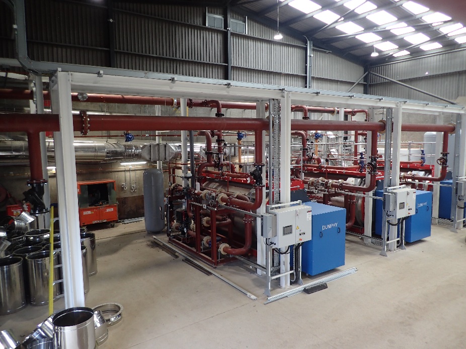 Torry heat network energy centre showing heat pumps and associated pipework.