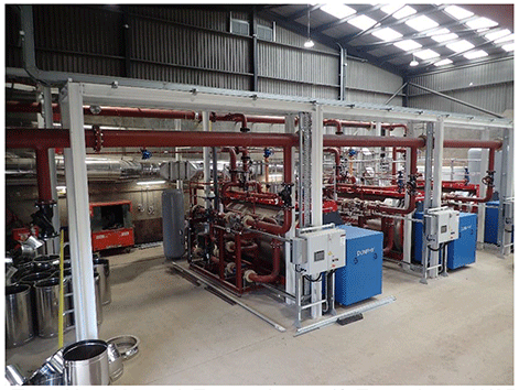 Torry heat network energy centre showing heat pumps and associated pipework.