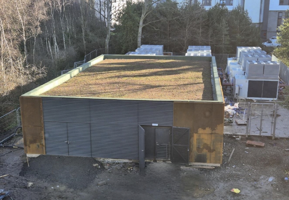 Energy centre at Western Villages site with start of planted green roof and air source heat pumps to the rear.