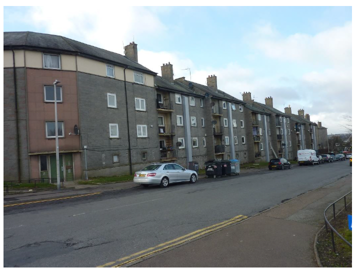 Long shot of row of flats.