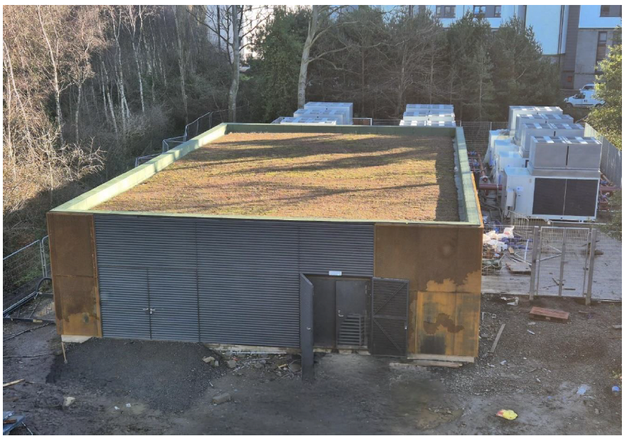 Energy centre at Western Villages site with start of planted green roof and air source heat pumps to the rear.