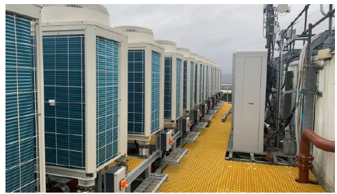 Air source heat pumps on rood of high rise flats. 