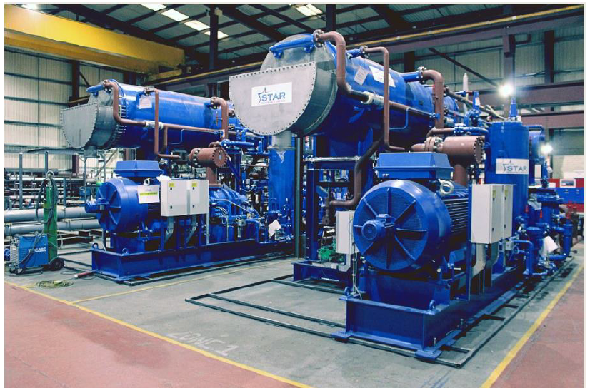 Large, blue water source heat pump equipment in the energy centre room at Queen's Quay.

