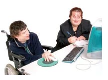 Two people on a computer