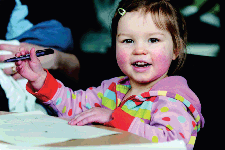 child with pen