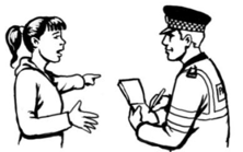 A woman speaking to Police officer, who is taking notes