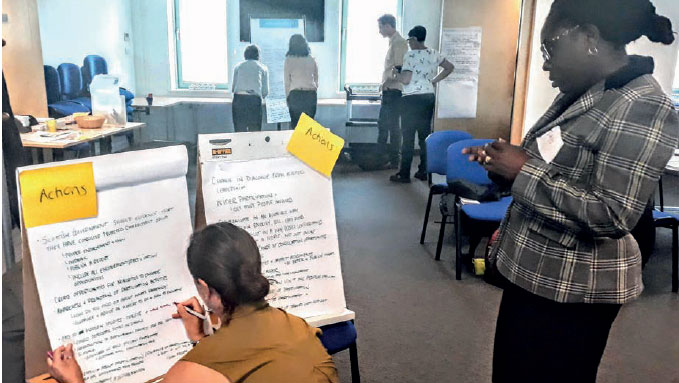 People taking part in a public discussion event, developing actions to create the Open Government Action Plan 