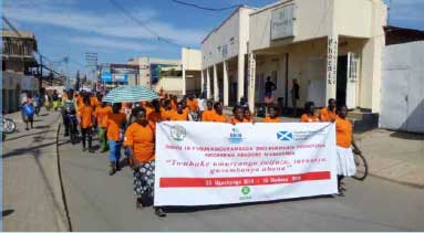 16 Days of Activism to End Violence Against Women and Girls: EVAWG march goes through Muhanga town centre in Rwanda (message on banner translates as: Building the family we want: say NO to child defilement)
