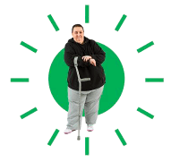 A person in the centre of a green circle with lines moving out from the centre.