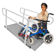 A person in a wheelchair using a ramp.
