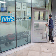 A man entering a NHS building