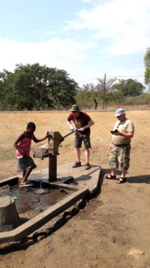 Image: SWI and Strathclyde University inspect borehole pump as part of Water point Mapping exercise in Malawi