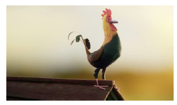 Cockerel standing on a roof.