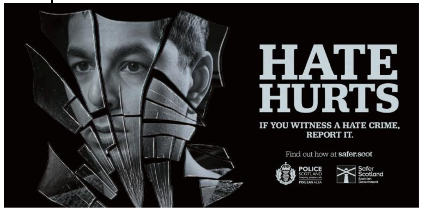 A poster for Hate Hurts Campaign. A man looking into a shattered mirror. 