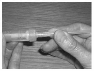 Push the extension tube on the syringe nozzle