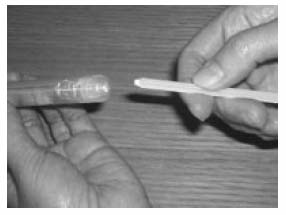 Pull the syringe plunger until it clicks and break off the stalk