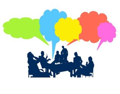 People around a desk with speech bubbles