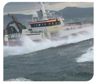 Fishing vessel ploughing through the sea