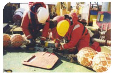 Scientists preparing a current meter mooring