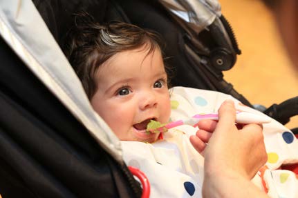 Baby being spoon fed